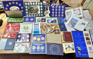 A large collection of assorted world coin sets, covers & coins to include a 50p 1992 coin cover,