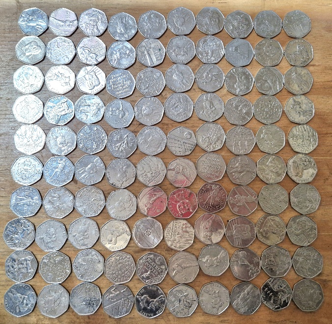 A group of 100 assorted collectable 50p coins.