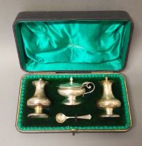 A cased hallmarked silver cruet, non matching spoon, silver weight 4.3ozt.