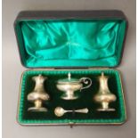 A cased hallmarked silver cruet, non matching spoon, silver weight 4.3ozt.