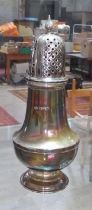 A hallmarked silver sugar shaker, height 15.5cm, weight 3.7ozt. Condition - top stiff, has been used