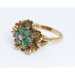 A diamond and emerald cocktail ring, hallmarked 9ct gold sponsor 'RJ', London 1969, gross weight 4.