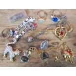 A mixed lot of mostly costume jewellery including 9ct gold cross etc.