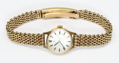 A ladies hallmarked 9ct gold Omega wristwatch with hallmarked 9ct gold strap, gross weight 32.3g.