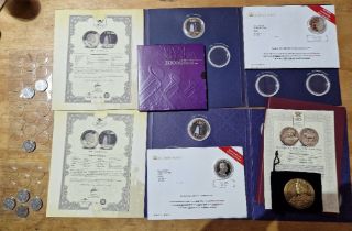 A group of assorted coins to include silver plated commemoratives, Beatrix Potter 50ps & a bronze