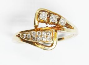 A diamond cluster ring, marked '585', gross weight 3g, size K. Condition - band slightly thing and