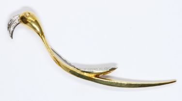 A novelty brooch modelled as a stylised bird and set with diamonds to beak eye and wing, yellow