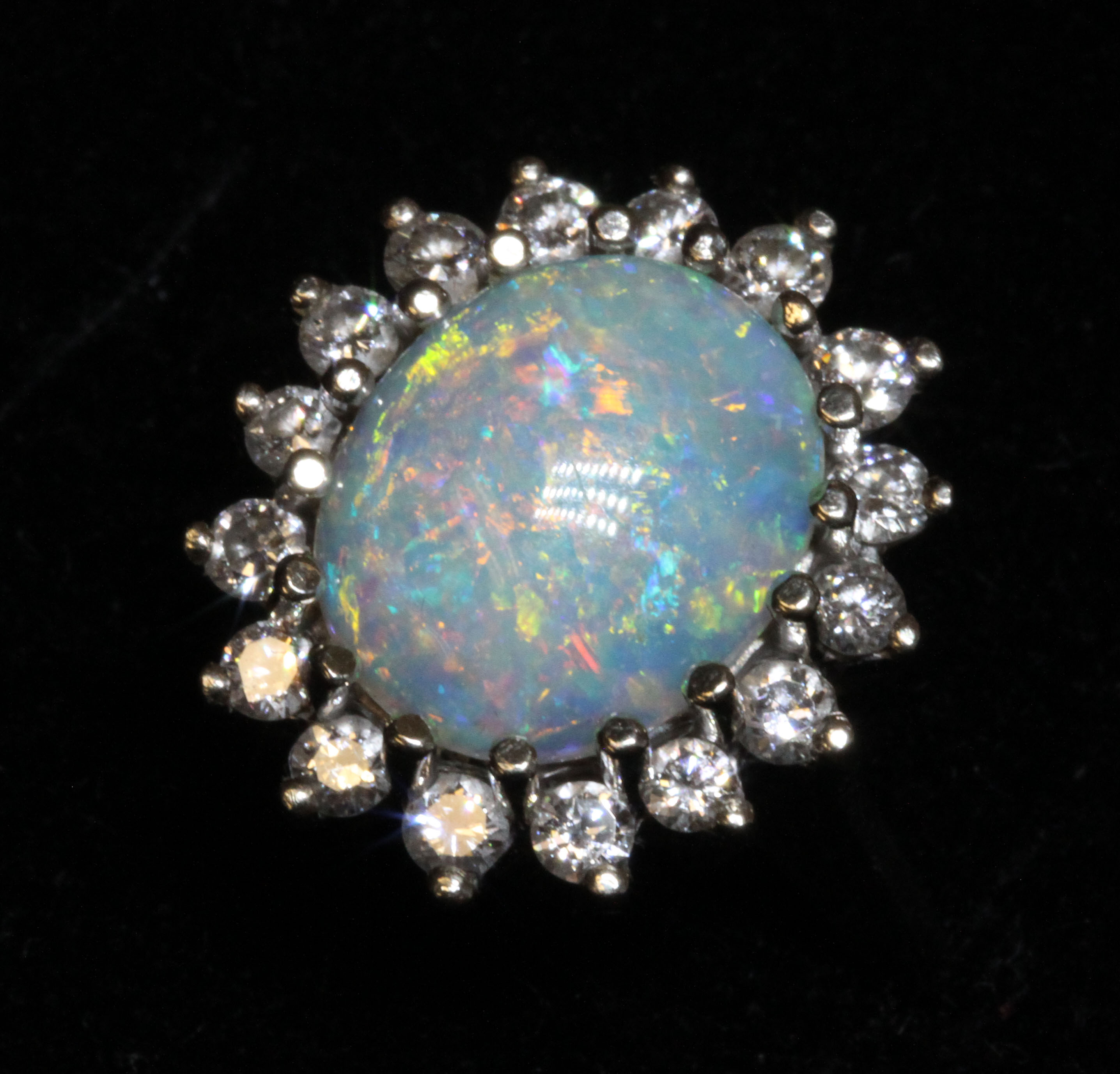 An opal and diamond cluster ring, the oval opal cabochon measuring approximately 12.58mm x 9.93mm, - Image 2 of 4