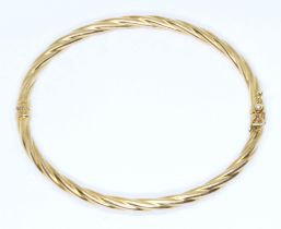A 9ct twist gold bangle, diameter approximately 58mm, weight 4.3g. Condition - good, general wear.