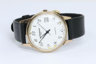 A hallmarked 9ct gold Le Cheminant wristwatch, case diameter 33mm, leather strap.