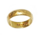 A hallmarked 22ct gold wedding band, weight 9.5g, size Q. Condition - good, general wear.