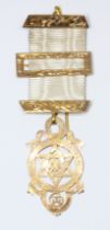 A hallmarked 9ct gold Masonic type medal, gross weight (including ribbon) 7.3g.