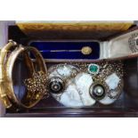 A Chinese box of assorted antique and vintage jewellery including a diamond stick pin marked '15ct',