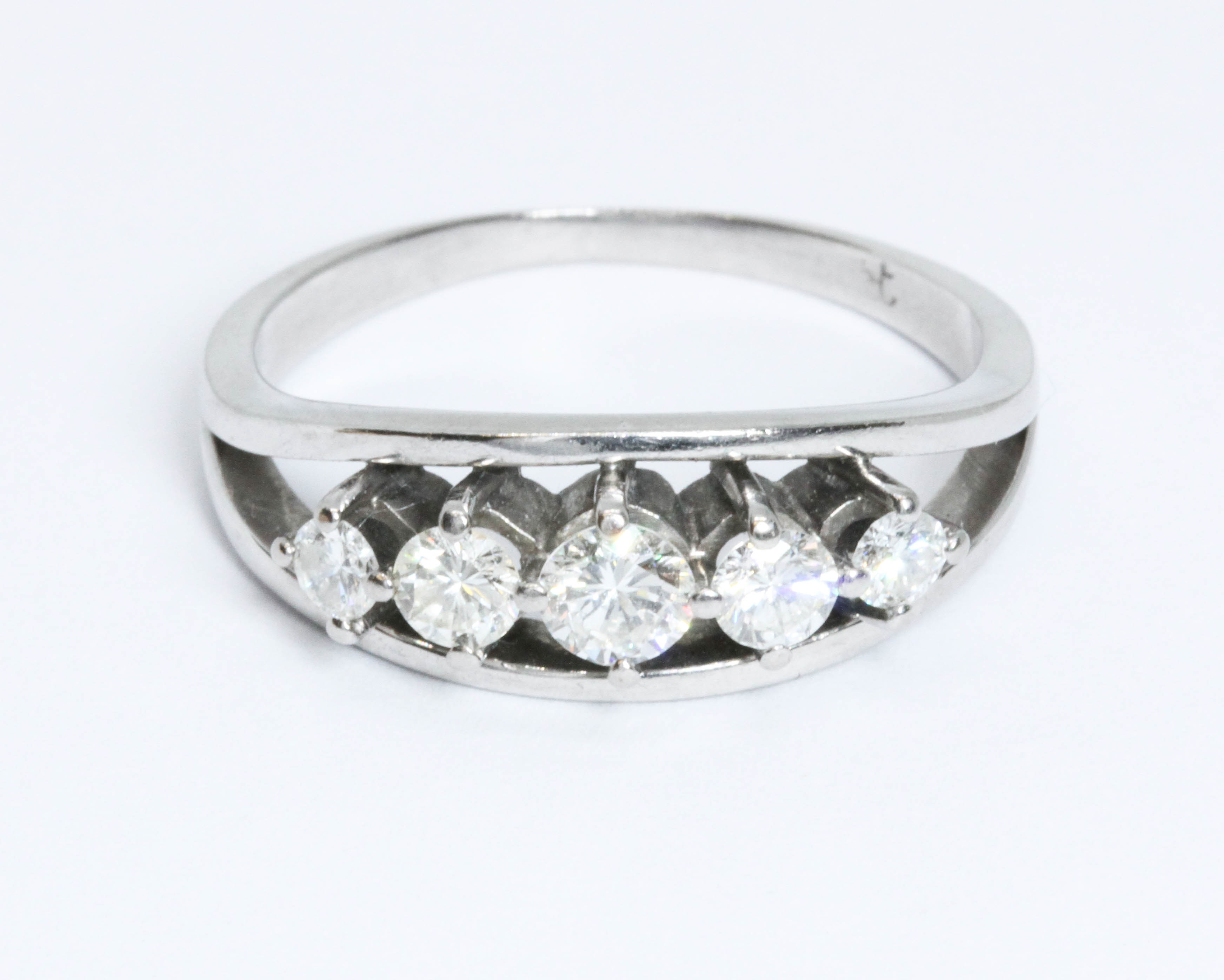 A five stone diamond ring, the round brilliant cut stones weighing approximately 0.07, 0.13, 0.22,