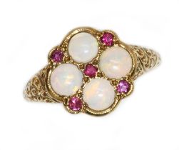 An opal and ruby cluster ring, the cluster measuring approximately 13.40 x 13.10mm, scroll