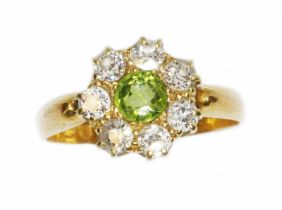 A Victorian diamond and green stone cluster ring, the central stone measuring approximately 4.85mm