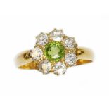 A Victorian diamond and green stone cluster ring, the central stone measuring approximately 4.85mm