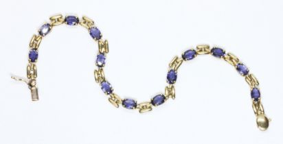 A 9ct gold tanzanite bracelet, international convention marks, length 17.5cm, gross weight 5.3g.