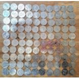 A group of 100 assorted collectable 50p coins.