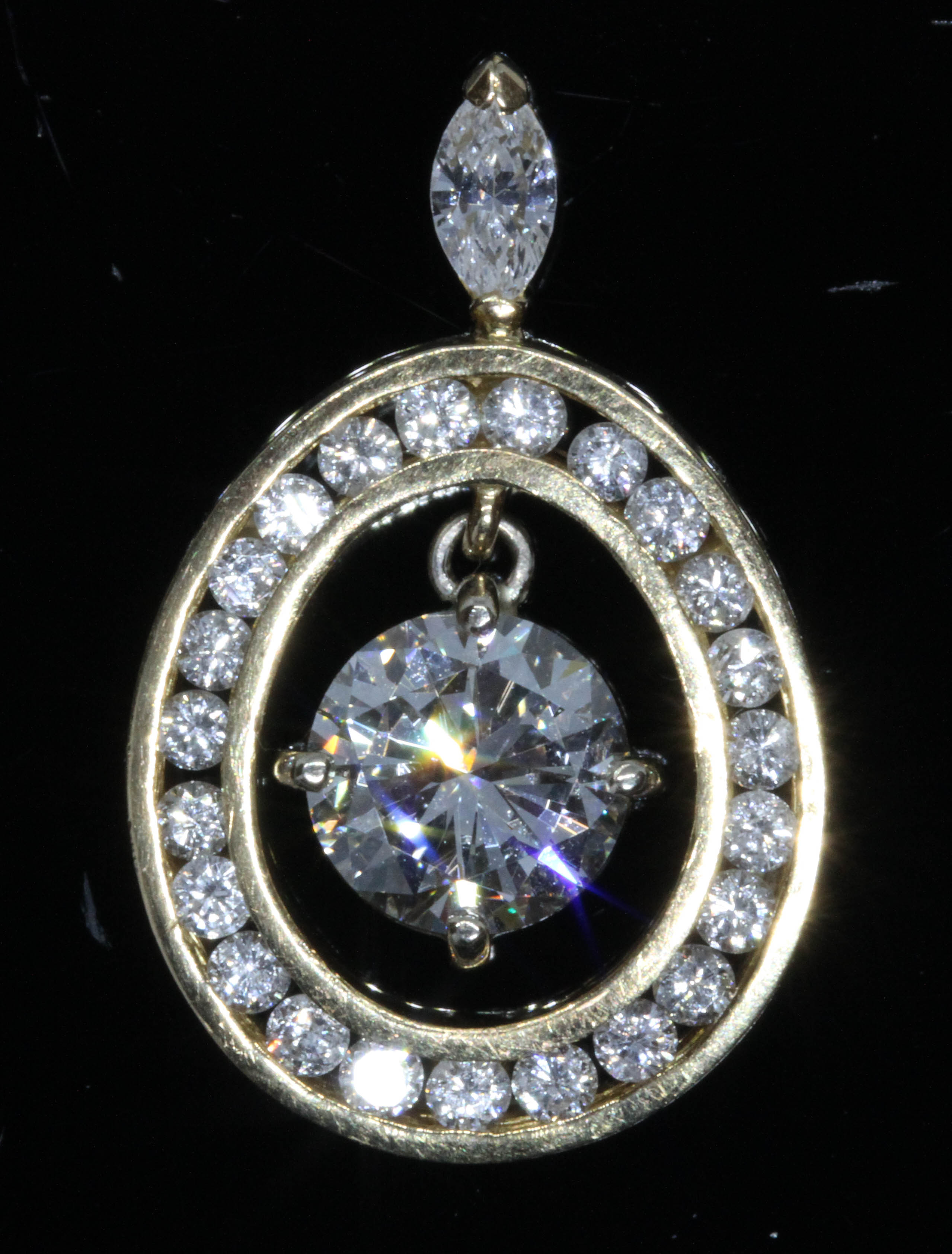 A diamond pendant, the central round brilliant cut stone weighing approximately 1.51 carats,