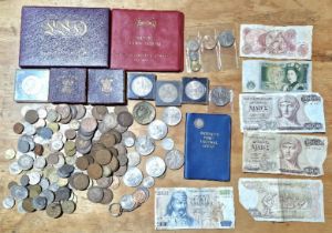 A tin of assorted GB & world coins, coin sets & banknotes to include a 1970 set, 2 x 1951 festival..