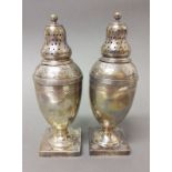 A matched pair of George III silver pepper pots, one hallmarked for Andrew Fogelberg, London 1810,