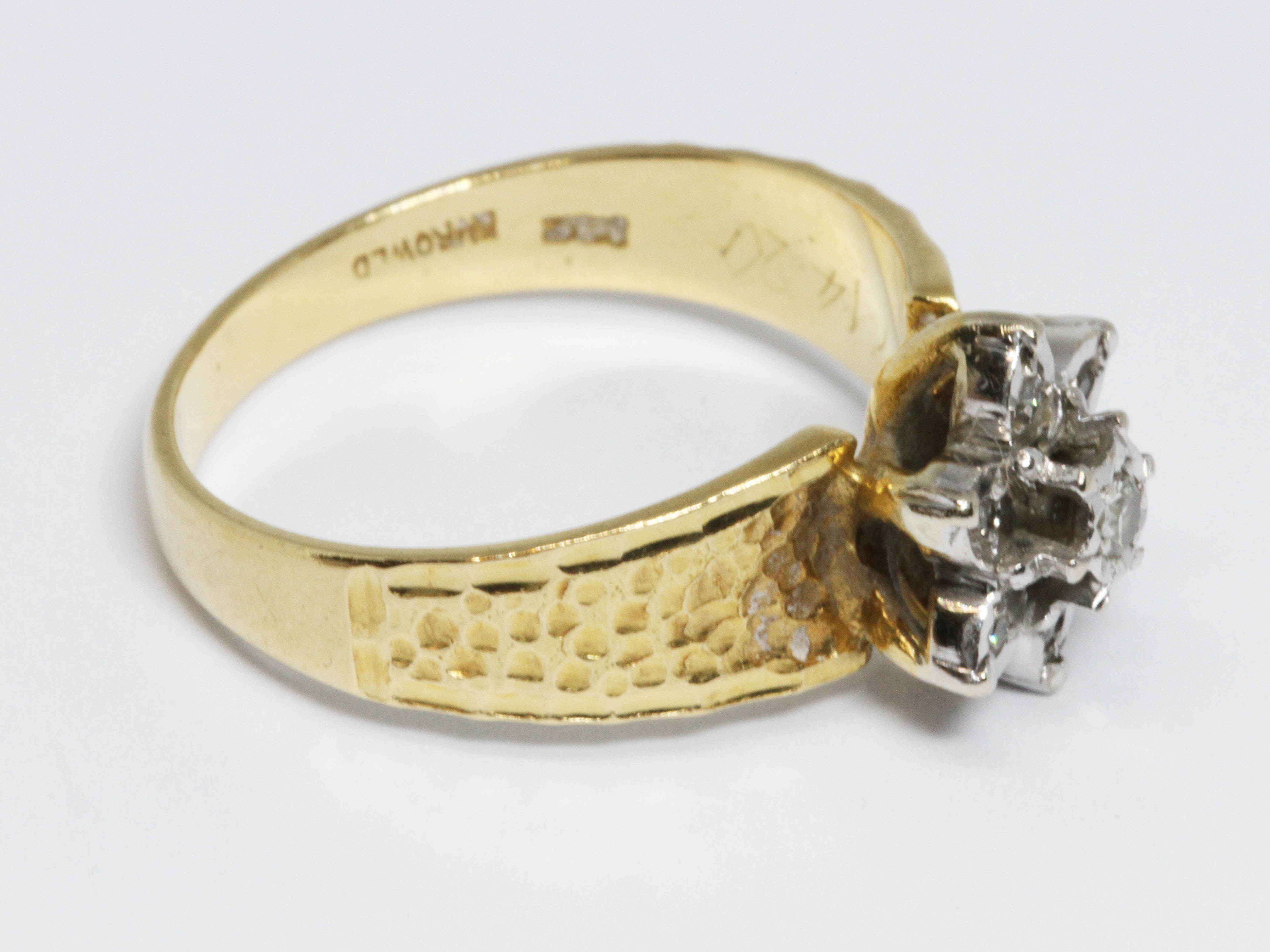 A hallmarked 18ct gold diamond cluster ring, the flower head cluster measuring approximately 10mm in - Image 3 of 4