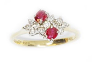 An 18ct gold ruby and diamond cluster ring, the cluster measuring approximately 13mm x 9.70mm,