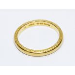 A 22ct gold wedding band, engraved design to sides, sponsor 'H.S', Birmingham 1933, weight 4.8g,