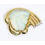 An 18ct gold opal and diamond brooch modelled as a cloud with central carved opal in front of a four