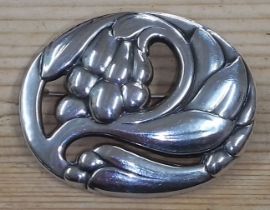 A Georg Jensen silver brooch, modelled as Art Nouveau style fruit and leaves, number 65, hallmarked,