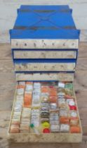 Five drawers of assorted watch spares.