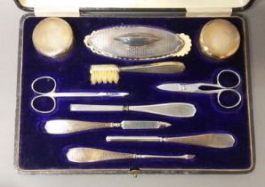 A cased hallmarked silver manicure set.