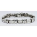 A diamond bracelet, the princess cut pave set stones weighing approximately 4.98 carats in total,