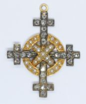 A 19th century Celtic cross style pendant set with rose cut diamonds and split pearls, yellow and