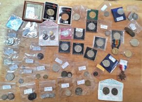 A box of assorted coins and medals to include commemorative crowns & some silver etc.