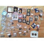 A box of assorted coins and medals to include commemorative crowns & some silver etc.