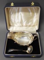 A cased hallmarked silver sauce boat and non matching hallmarked silver ladle, gross weight 4.2ozt.