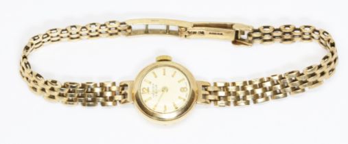 A ladies hallmarked 9ct gold Vertex wristwatch with hallmarked 9ct gold strap, gross weight 14.7g.