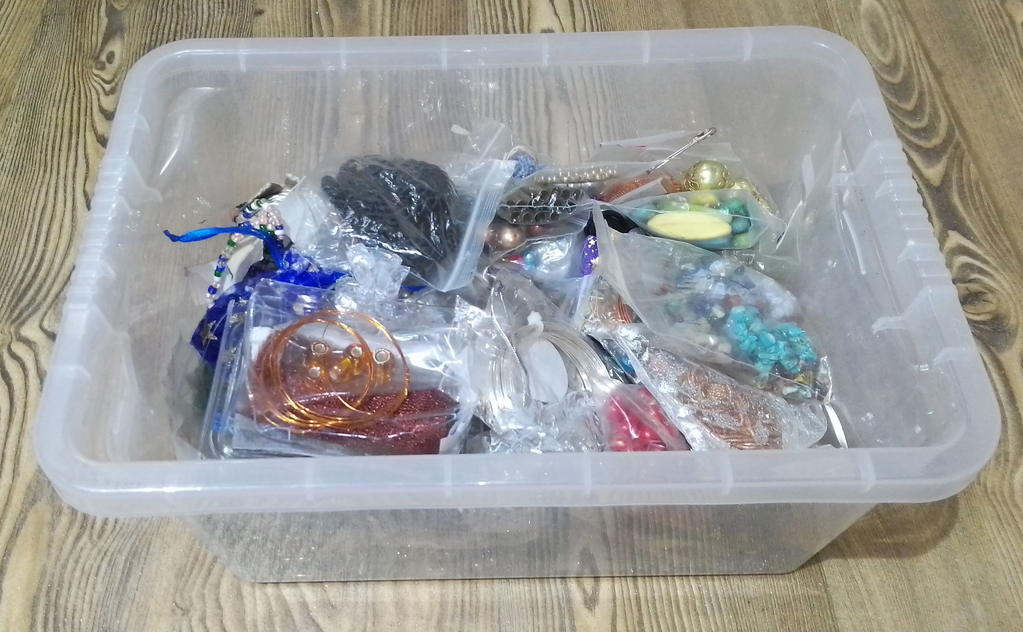 A box of assorted costume jewellery.