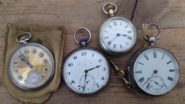 Three silver pocket watches and another.