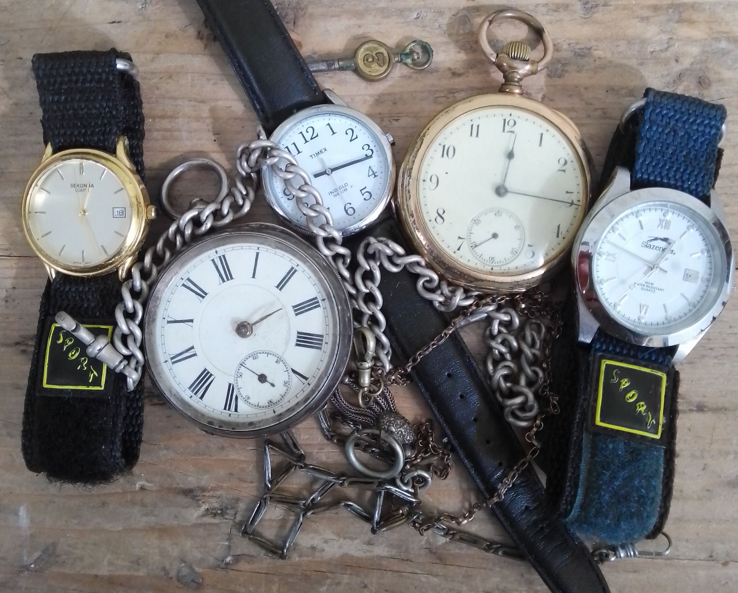 A mixed lot of watches comprising two pocket watches and three wristwatches including silver,