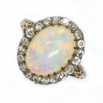 An antique opal and diamond ring, circa 1900, the opal cabochon measuring approximately 14.20 mm x