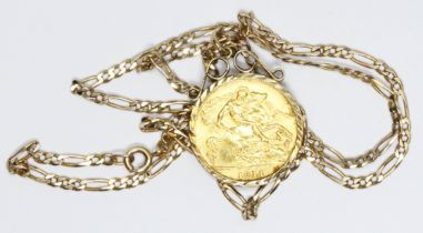 A George V 1911 half sovereign, hallmarked 9ct gold pendant mount, 36cm figaro chain, 9ct gold