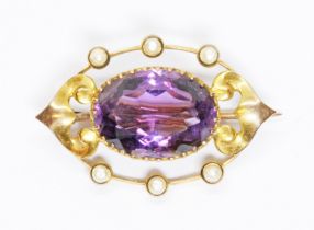 An antique Art Nouveau style amethyst and seed pearl brooch, marked '9ct', length 27mm, gross weight