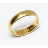 A hallmarked 22ct gold wedding band, weight 6.6g, size P/Q. Condition - good, general wear only.