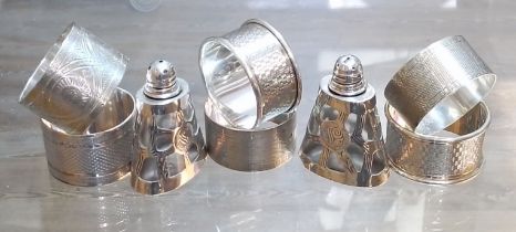 Six assorted hallmarked silver serviette rings, weight 5.3ozt, together with a pair of Mexican white