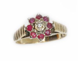 A hallmarked 9ct gold diamond and ruby cluster ring, gross weight 2.6g, size N. Condition - good,