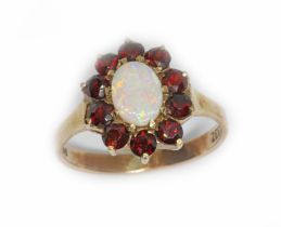 An opal and garnet cluster ring, marked 'ZEETA' and '9ct', gross weight 2.8g, size M. Condition -