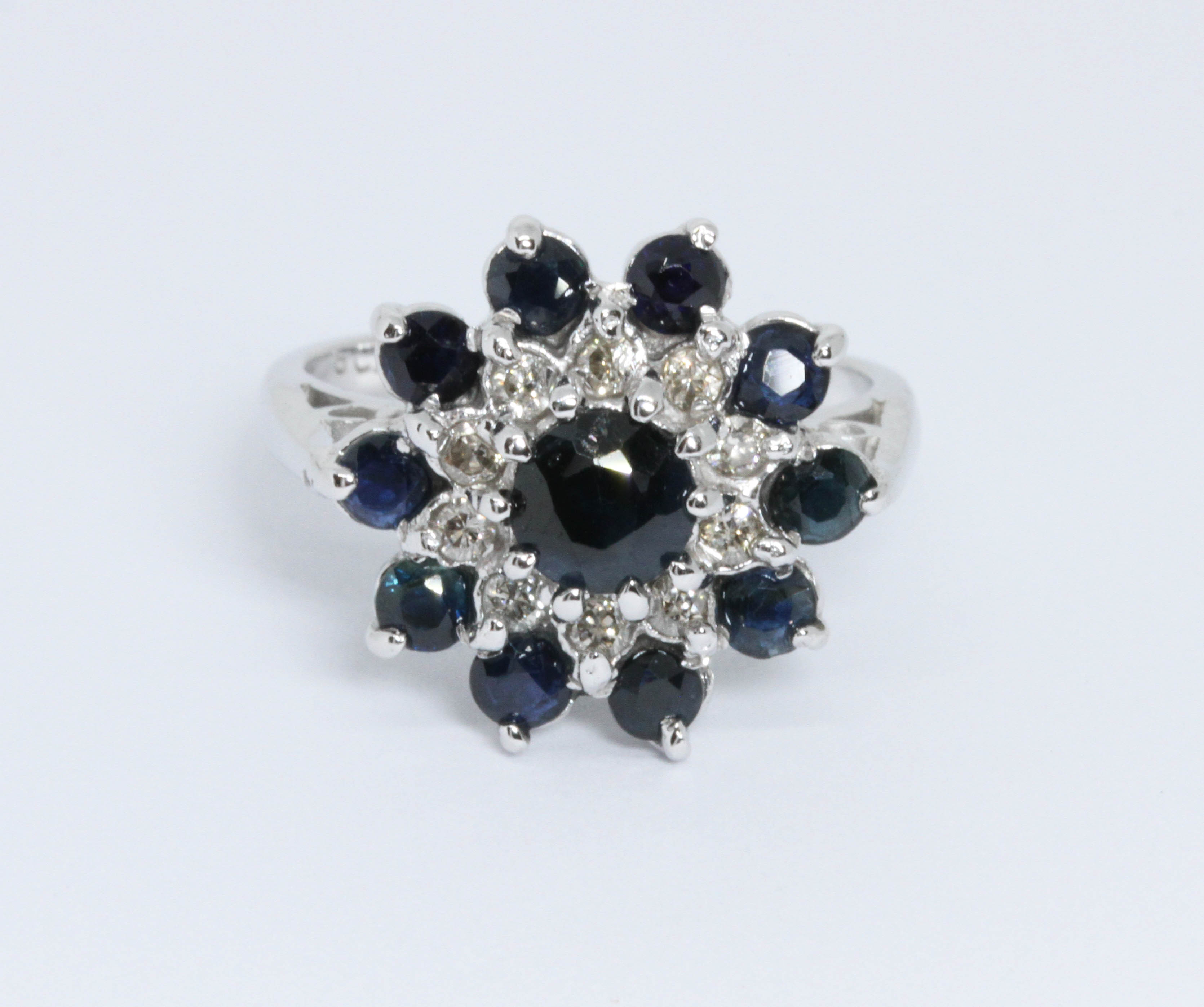 A diamond and sapphire cluster ring, the cluster measuring approximately 16mm in diameter, white - Image 4 of 5